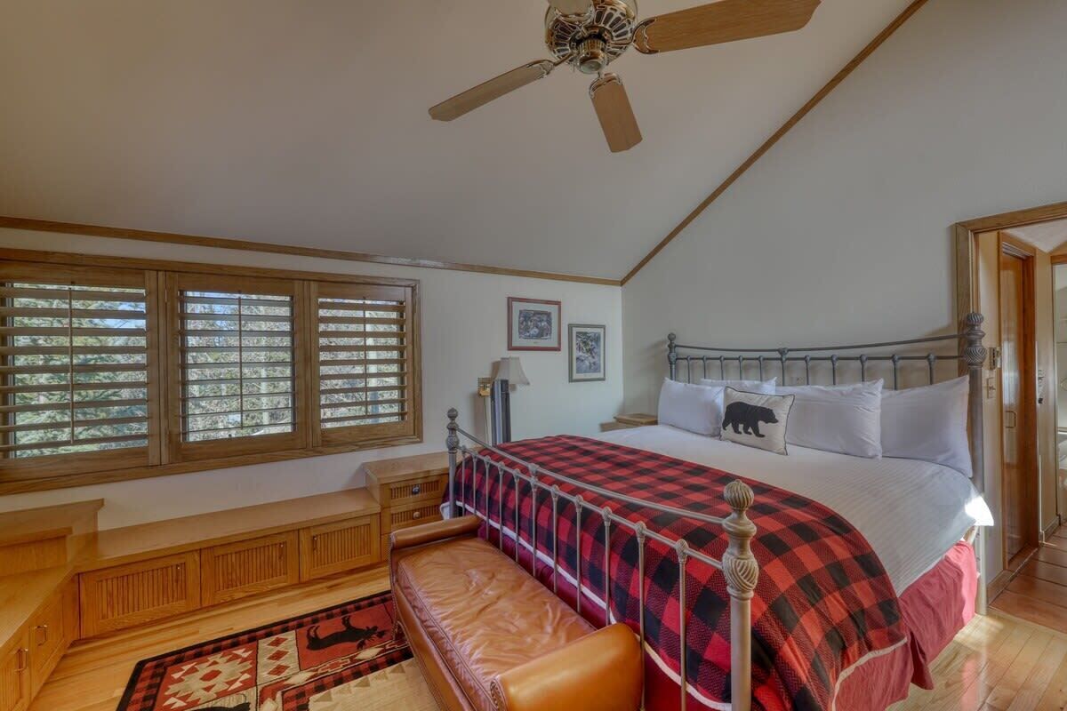 Fifth floor bedroom with a king bed, flat screen TV, and en suite bathroom