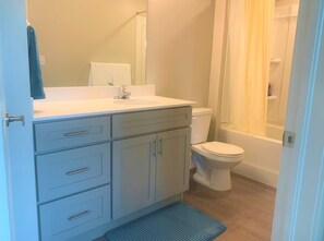 Combined shower/bathtub, hair dryer, towels, soap