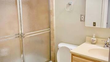 Combined shower/tub, hair dryer, towels, soap