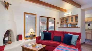 Condo, 2 Queen Beds, Patio, Garden View (#101 - Pets) | Living area | TV, fireplace