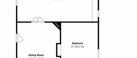 Un plan d’étage comprenant un salon, une salle à manger, une cuisine, deux chambres, un dressing, un hall d’entrée et une salle de bain.