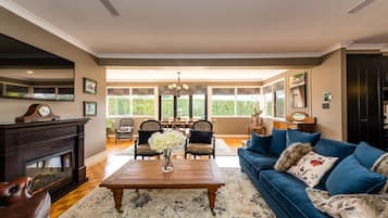 Living area | TV, fireplace, books