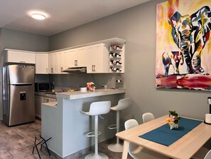 Fridge, microwave, stovetop, coffee/tea maker