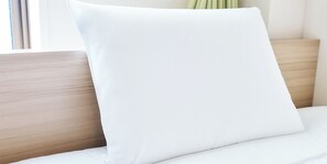 A white pillow on a bed with a wooden headboard. - Rakuten STAY URBAN Shijo Teramachi (Kyoto)