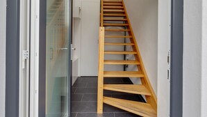 A staircase with wooden steps leading to a landing. - Pleasant Holiday Home in Zierow near Sea (Zierow)