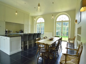 Enjoy cooking in this well-equipped kitchen with a central island and ample seating.
