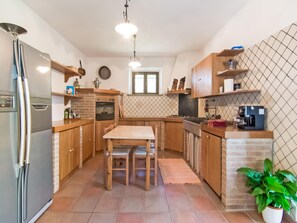 Villa | Private kitchen | Highchair, dining tables