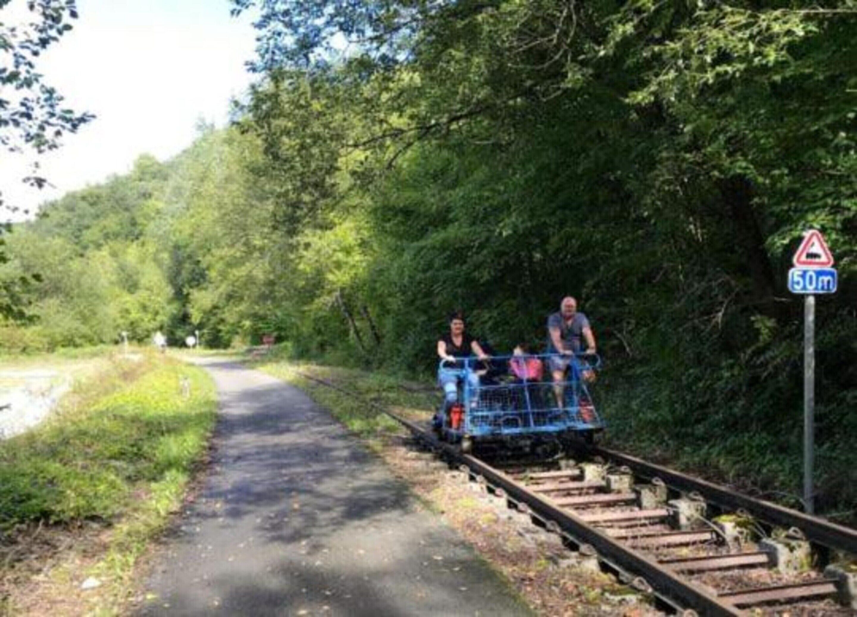 A railway track with a sign indicating a height restriction of 50m.