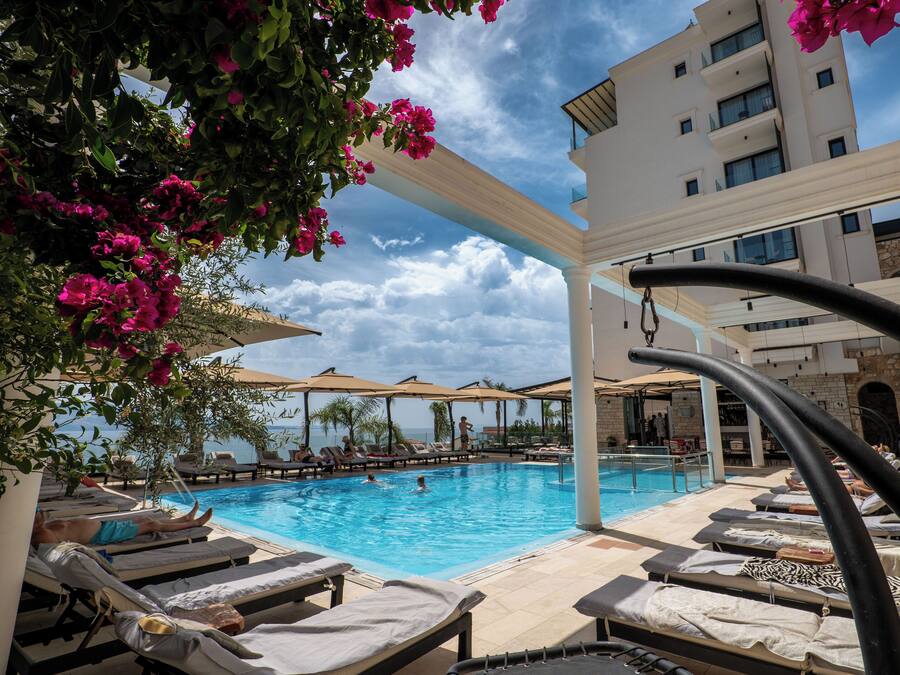 Seasonal outdoor pool, open 8:00 AM to 8:00 PM, pool umbrellas
