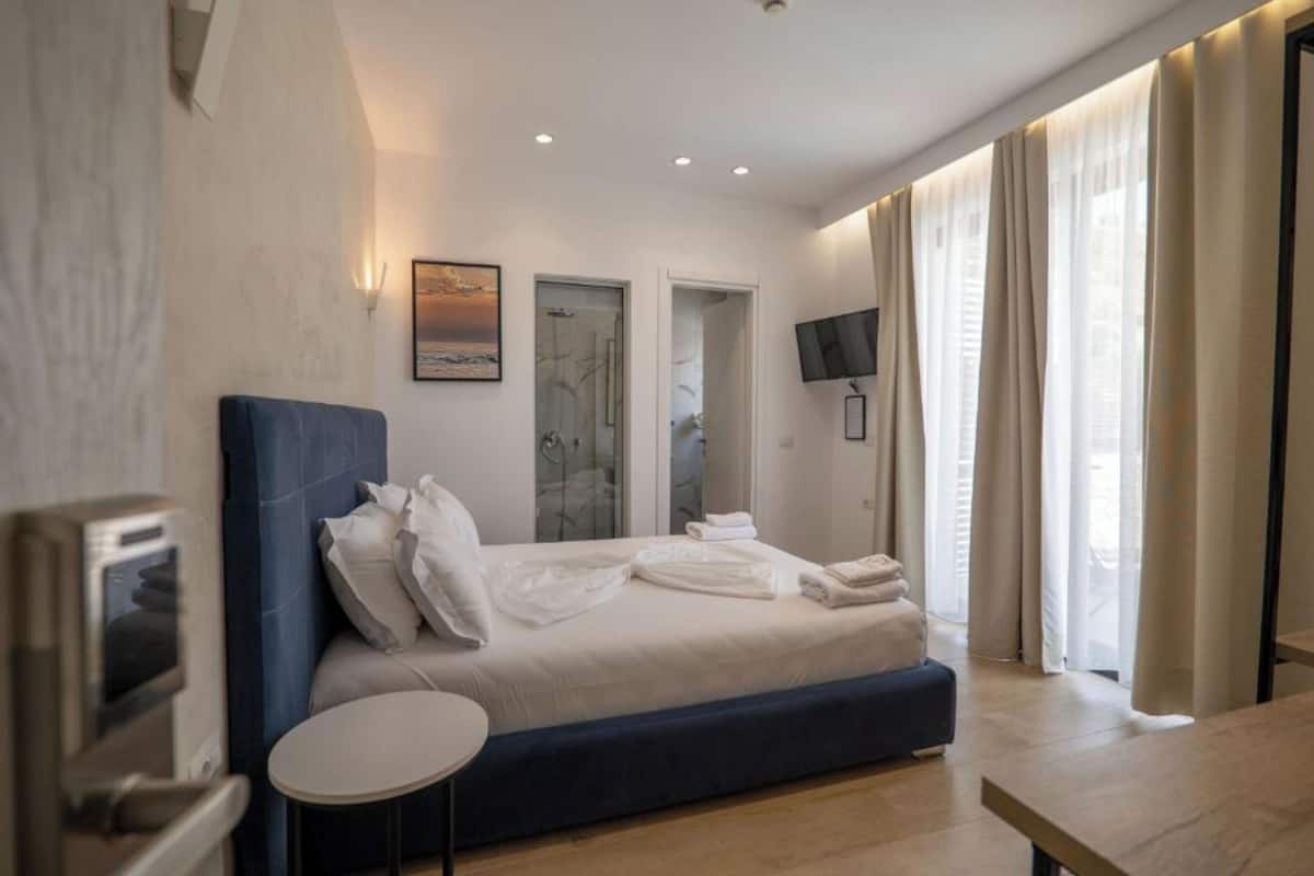 Deluxe Double Room, Partial Sea View | In-room safe, laptop workspace, blackout drapes, WiFi (free)