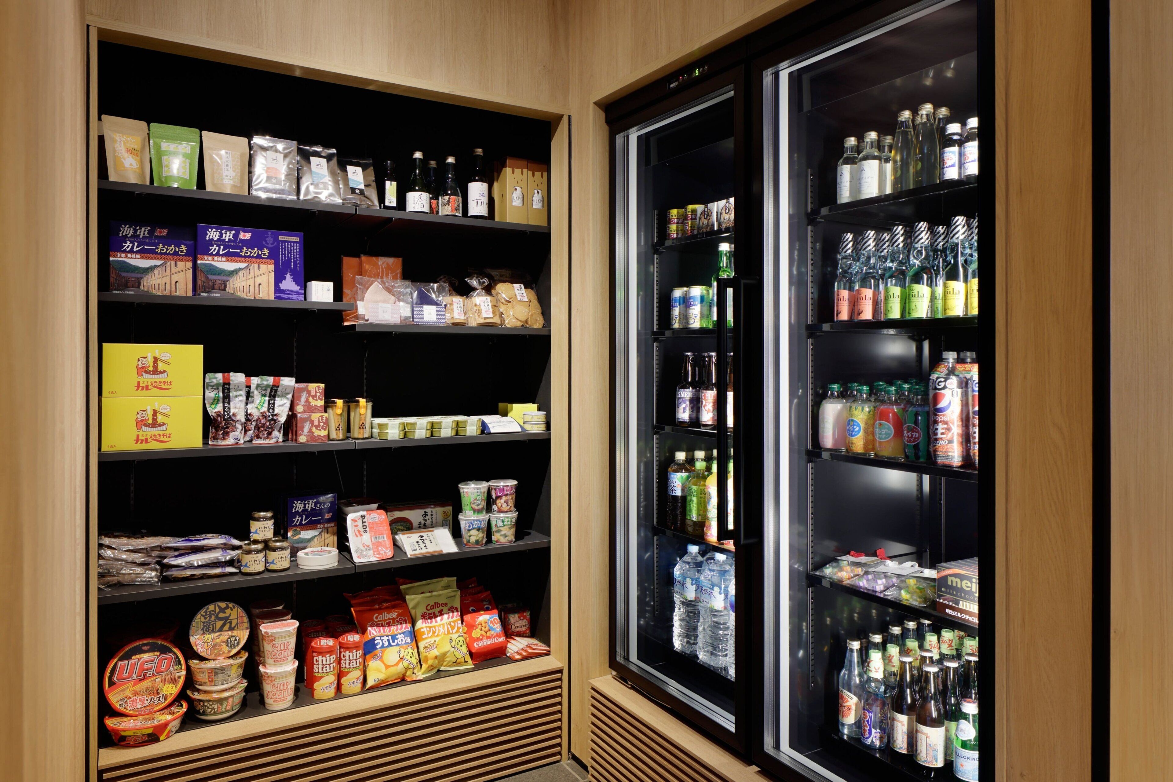 A refrigerated display case with various beverages and snacks.