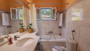 Combined shower/bathtub, hair dryer, towels, soap