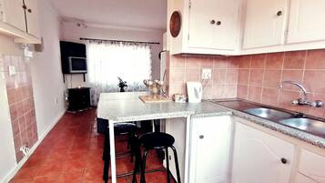 Comfort Apartment, 2 Bedrooms | Private kitchen | Full-sized fridge, microwave, electric kettle, cookware/dishes/utensils
