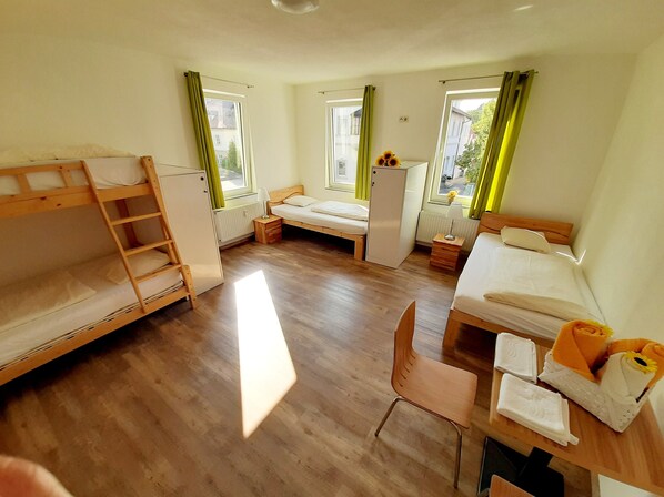 Standard Quadruple Room, Shared Bathroom | Laptop workspace, free WiFi, bed sheets