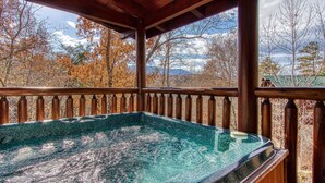 A hot tub under a wooden pergola with a view of autumn trees and mountains. - Natural Beauty: Hot Tub, Gameroom. Arts & Crafts (Gatlinburg)