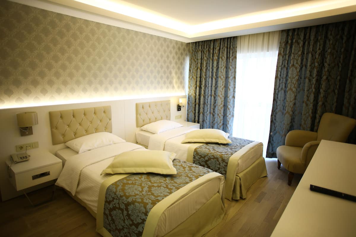Chambre Standard | 1 chambre, coffres-forts dans les chambres, fer et planche à repasser