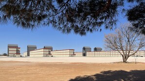 A large industrial building complex with multiple warehouses and a parking area. - The Armadillo Hotel (Odessa)