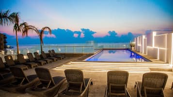 Outdoor pool, open 9:00 AM to 10:00 PM, pool loungers