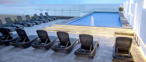 Outdoor pool, open 9:00 AM to 10:00 PM, sun loungers