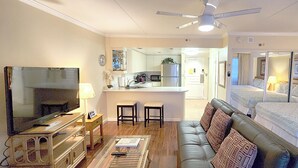 A hotel room with a living area, kitchenette, and a bedroom. - Luxury Ocean Marina View Studio World Famous Ilikai NO RESORT FEES! FREE WIFI (Honolulu)