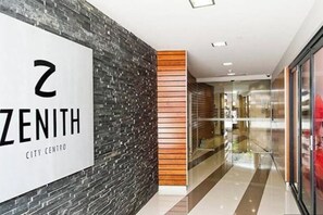 A modern interior with a sign reading '2 ZENITH CITY CENTER.'