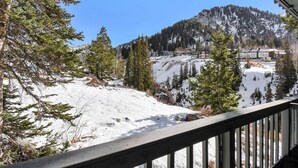 A snowy mountain landscape with a wooden deck overlooking the area. - Great Weekend Destination-Between Snowbird & Alta, Hot Tub, BBQ, Free Parking, Free Ski Rental (Alta)