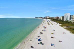 On the beach, beach towels - Beautifully Renovated Beachfront Condo; Resort Amenities, Beach Gear & WiFi ~Walk to Everything (Marco Island)