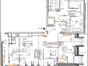A hotel floor plan with multiple rooms, a kitchen, and a dining area.