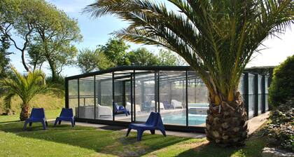 Longère (traditional long house) with covered and heated swimming pool in the Domaine des Abers***.