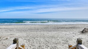A beach with wooden barriers and a clear view of the ocean. - Oceanfront 4 Bedroom, 3 Bath with Community Pool (Garden City Beach)