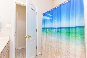 Combined shower/tub, hair dryer, towels, soap