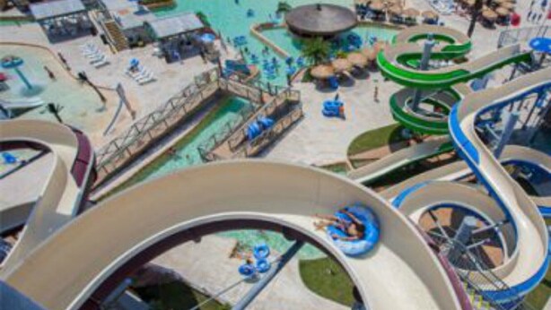 A water park with multiple slides and pools. - Spacious family home with patio, steps away from the beach with a pool onsight! (Corpus Christi)
