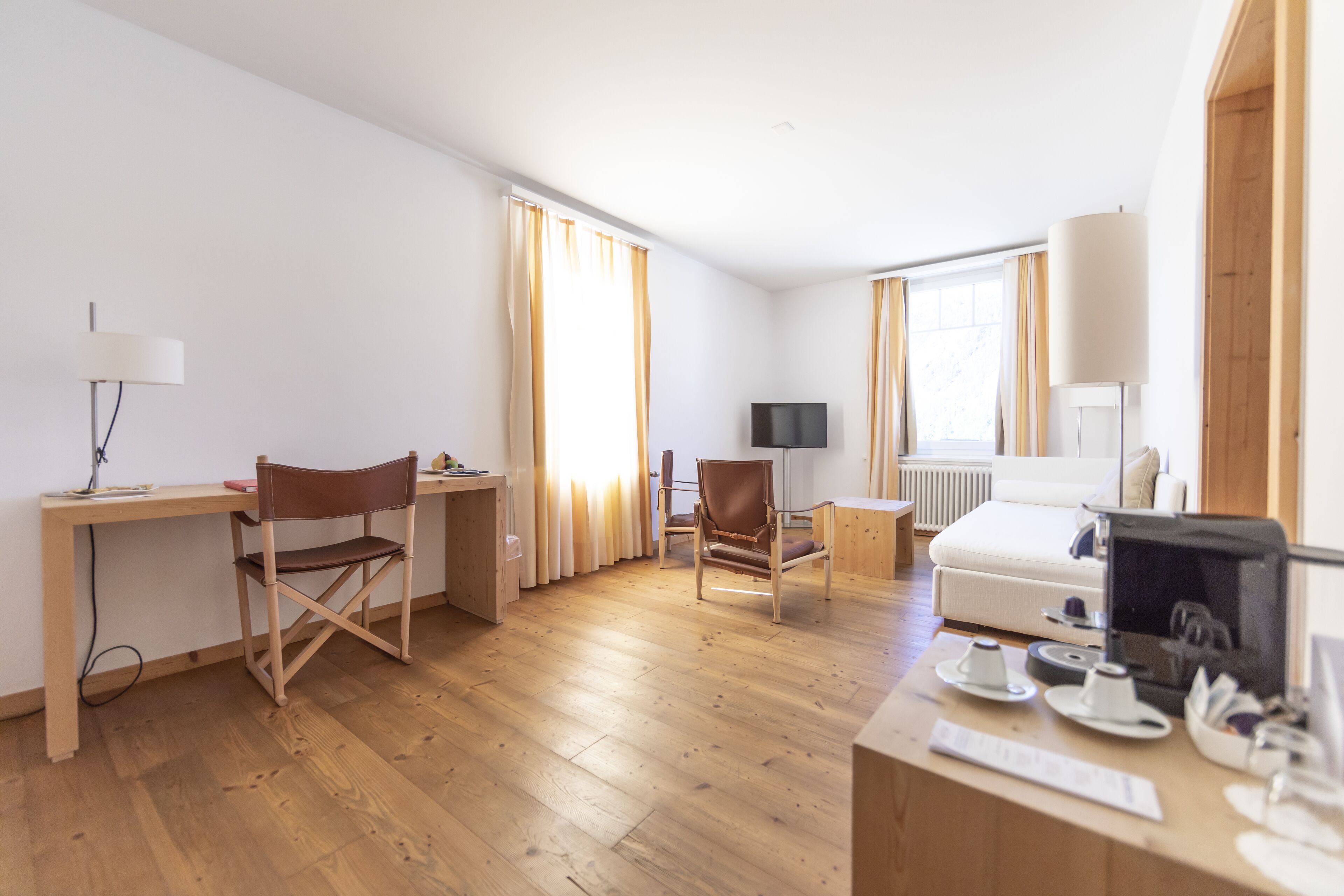 junior suite | living area | 4-inch lcd tv with cable channels, tv, heated floors