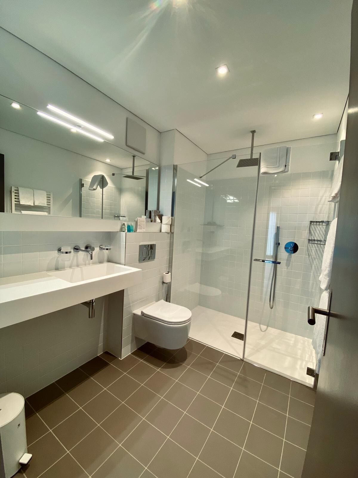 junior suite | bathroom | shower, free toiletries, hair dryer, bathrobes