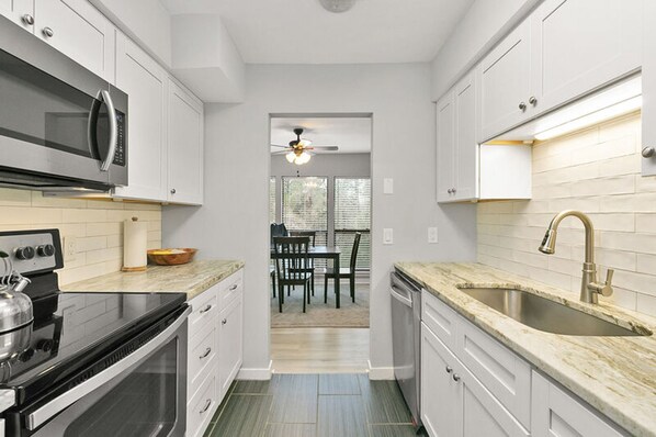 Condo, 2 Bedrooms | Private kitchen | Fridge, microwave, stovetop, dishwasher