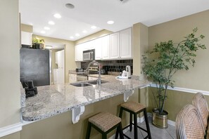 Condo, 2 Bedrooms | Private kitchen | Fridge, microwave, stovetop, dishwasher