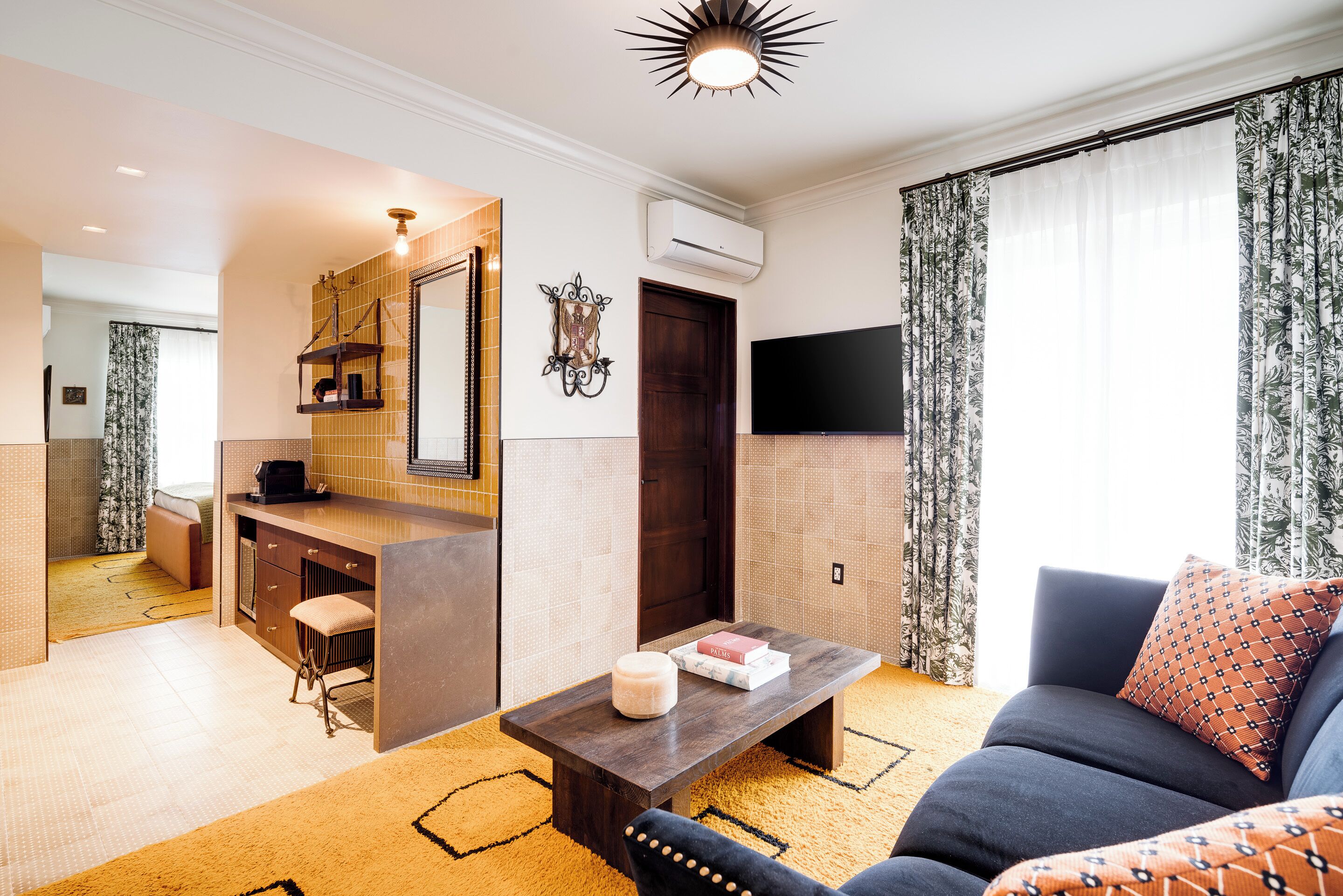 capone suite | living area | 43-inch smart tv with digital channels, tv, tablet