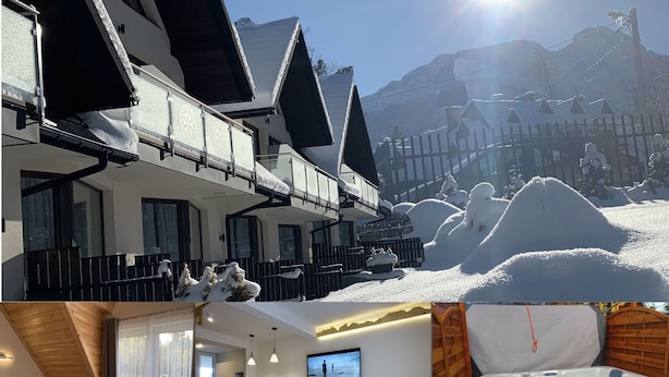 A hotel with a ski slope view, a dining area, a living room with a fireplace, and a hot tub. - Apartamenty Domki Giewont (Zakopane)