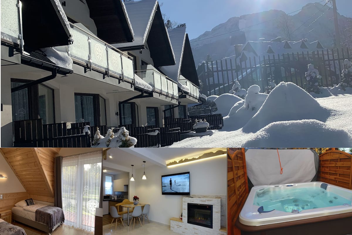 A hotel with a ski slope view, a dining area, a living room with a fireplace, and a hot tub.