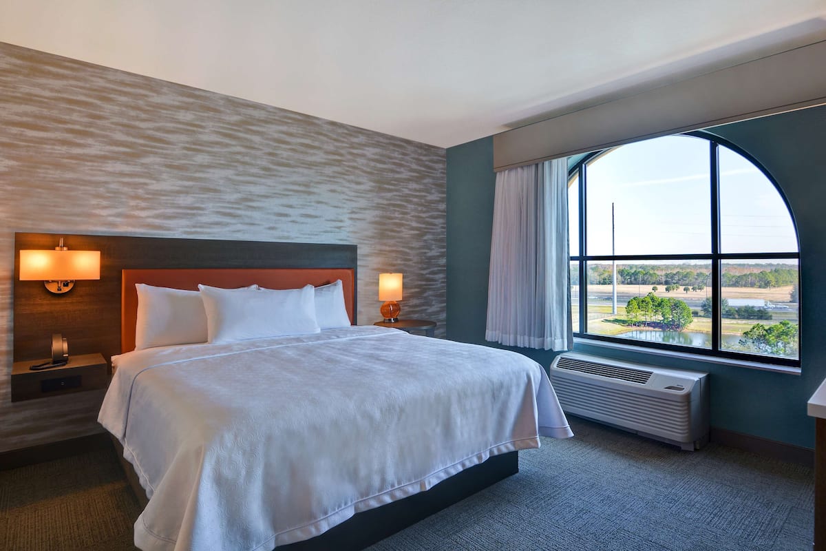 Desk, iron/ironing board, bed sheets
