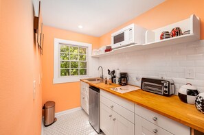 Fridge, microwave, stovetop, coffee/tea maker