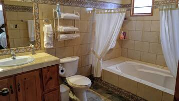 Combined shower/tub, towels, toilet paper