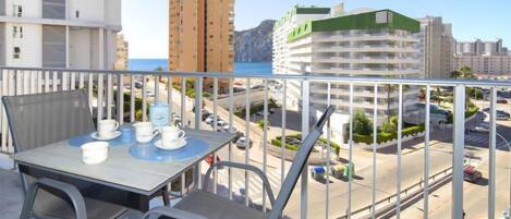 Enjoy a romantic meal for two on this balcony overlooking the city and water.