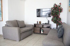 Smart TV, books - Departamento en avenida principal 4 Pax A 15 min de la playa  con AC y terraza (Playadelcarmen)