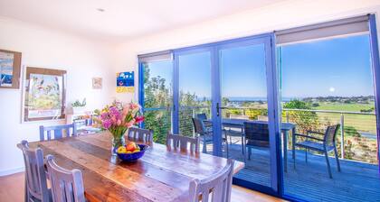 A two- story house with sweeping views of Bass Strait and the North Arm.