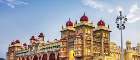 A large, ornate building with multiple domes and arches, likely a historical or cultural landmark.