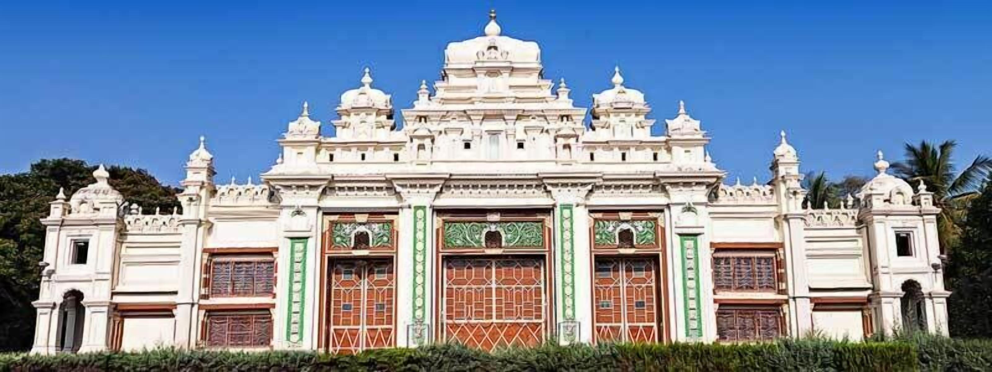 A large, ornate building with multiple domes and intricate architectural details.