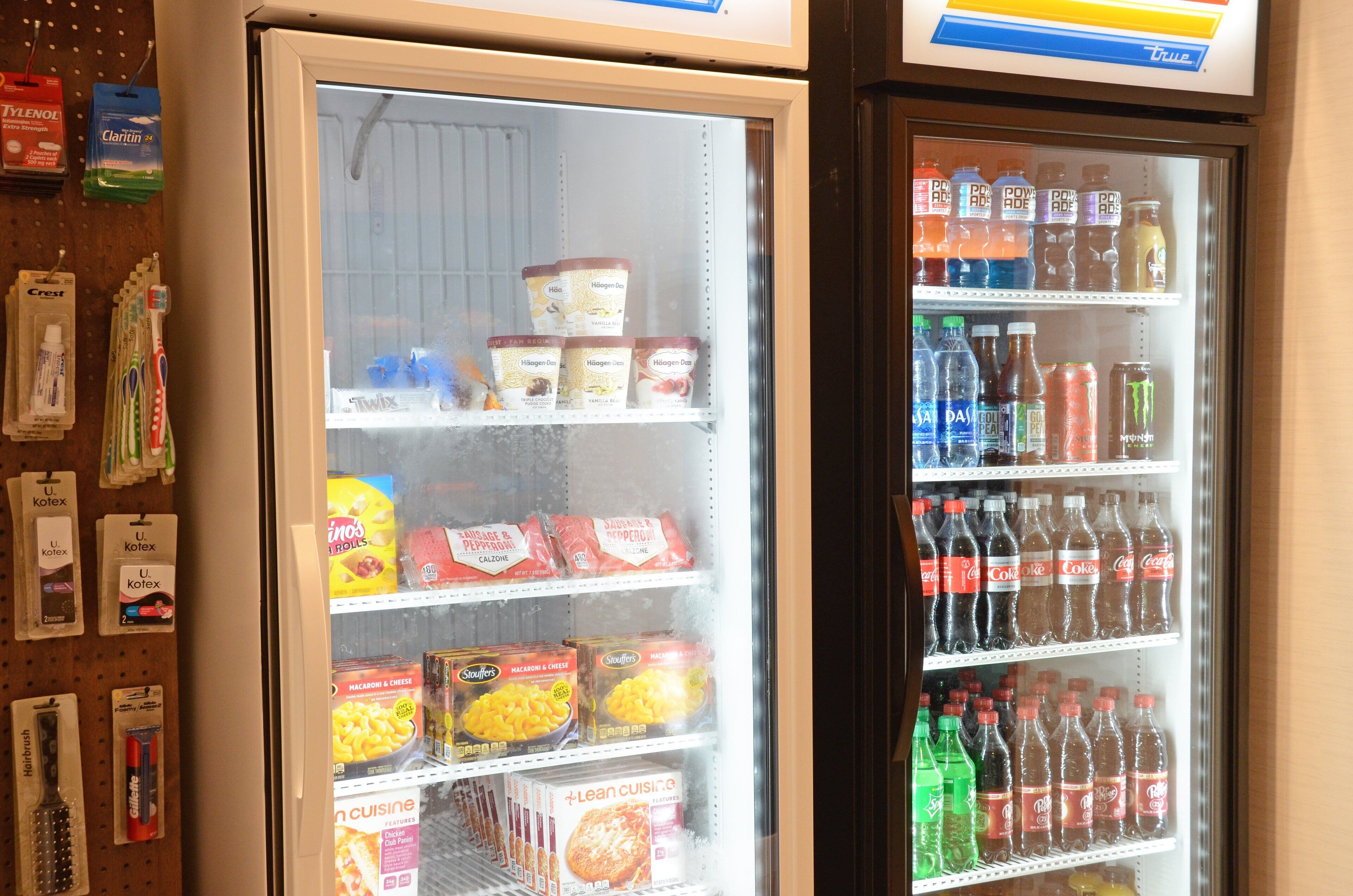 A refrigerated display case with various food items and beverages.
