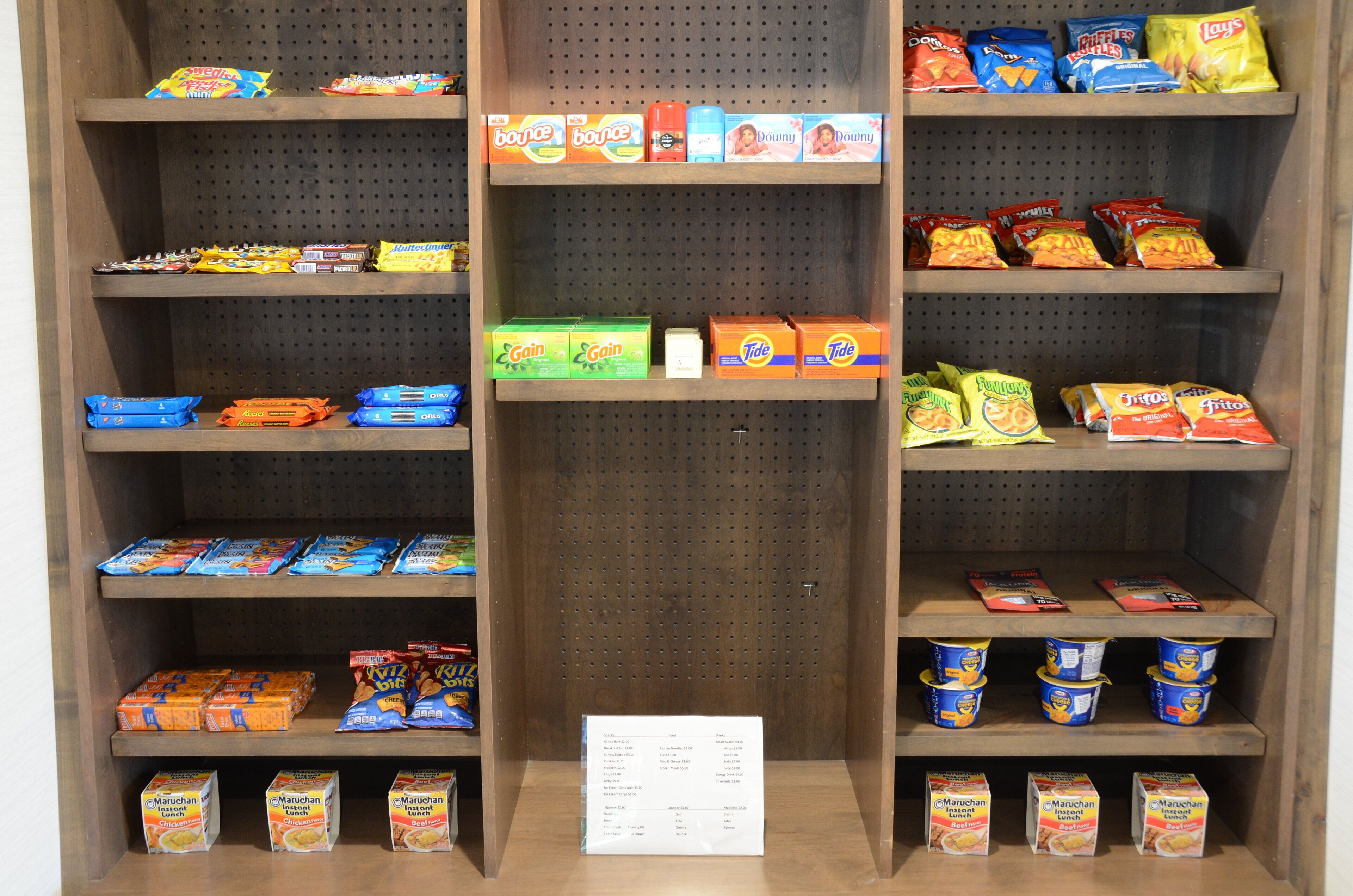 A snack aisle with various packaged foods and beverages.