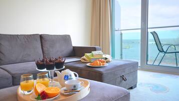 Comfort Apartment, Balcony, Sea View | Living area | 40-inch LED TV with satellite channels, TV, heated floors
